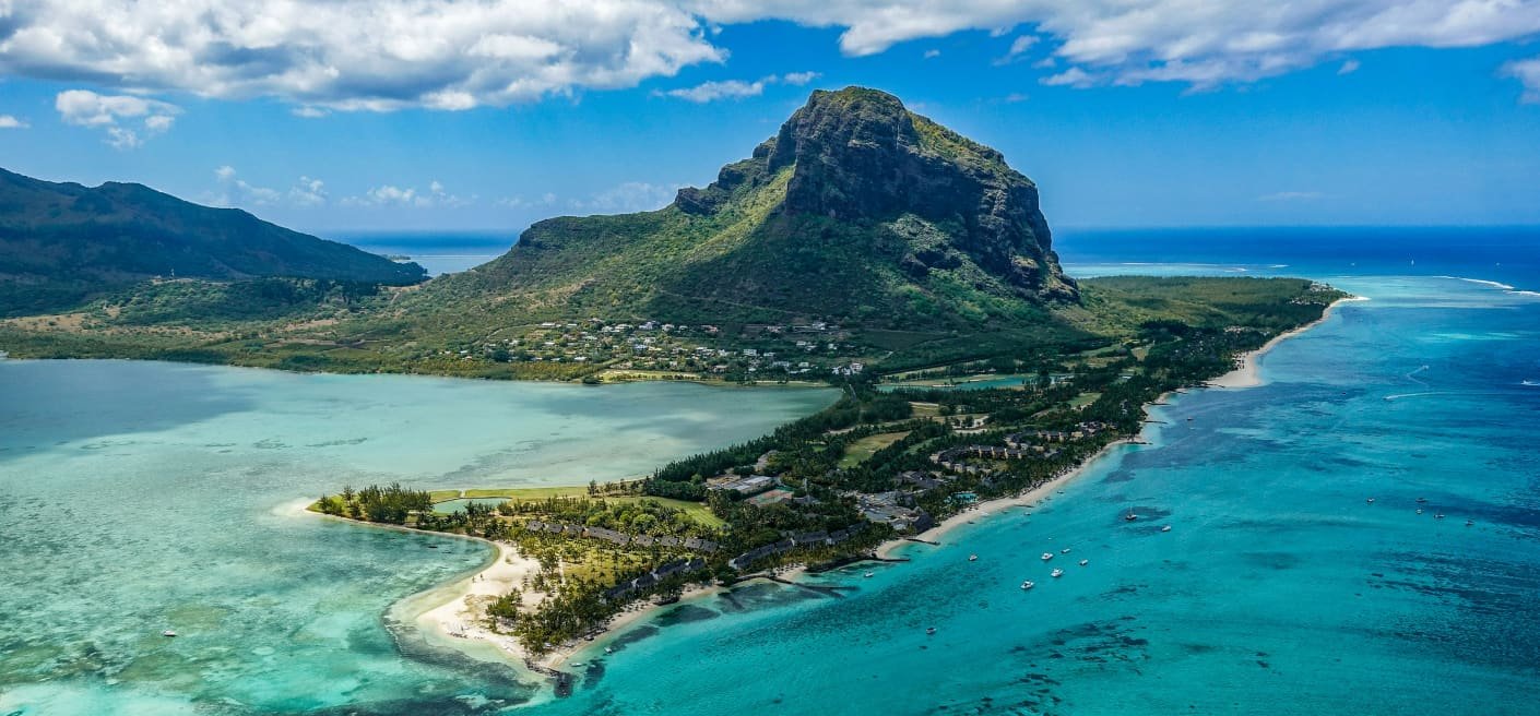 Mauritius skyline with waterfront buildings and mountains in the background